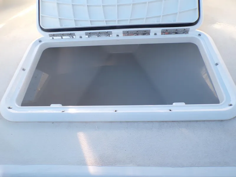 Slide: The Image of Open storage compartment on 2024 Parker 1801 Center Console boat. - 30