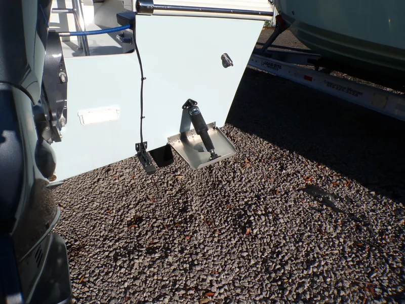 Slide: The Image of 2024 Parker 1801 Center Console boat on gravel, showing rear details and trailer. - 4