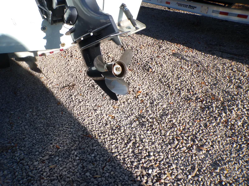 Slide: The Image of 2024 Parker 1801 Center Console boat propeller on gravel surface. - 5