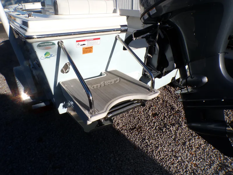 Slide: The Image of 2024 Parker 1801 Center Console boat with swim platform and outboard motor. - 6