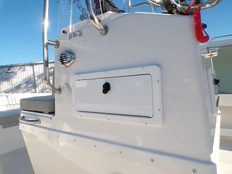 Slide: The Image of 2024 Parker 1801 Center Console boat, side view of control panel and storage compartment. - 7