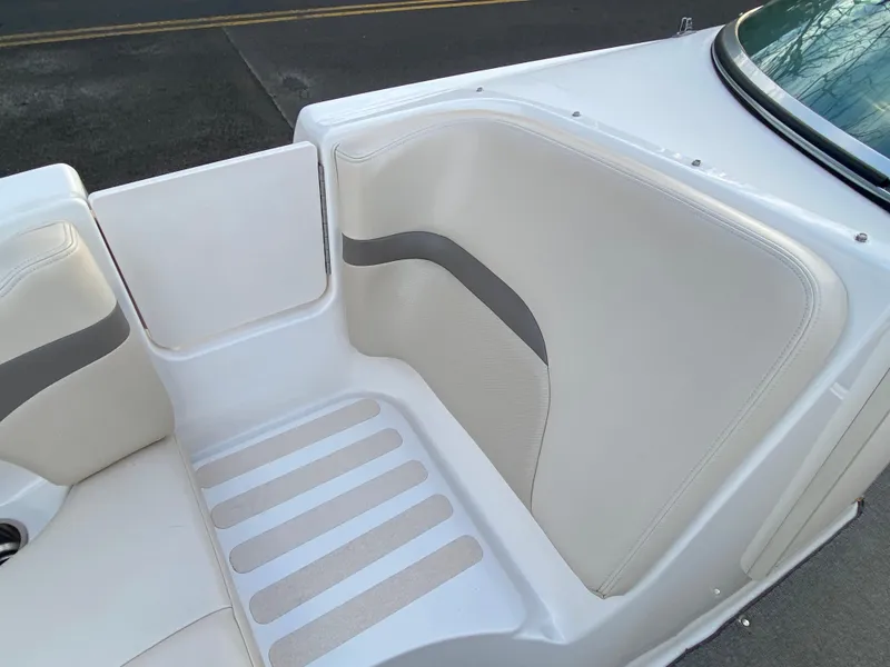 Slide: The Image of 2005 Chaparral Sunesta 254 boat interior with white and gray seating. - 11