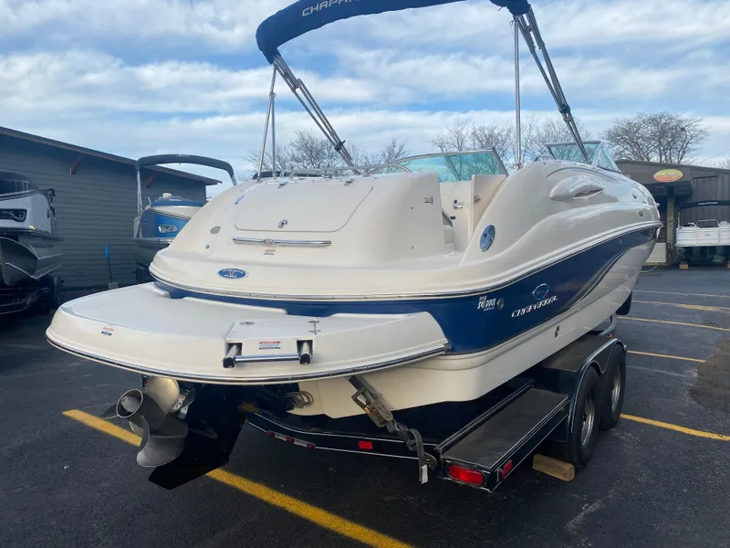 Slide: The Image of 2005 Chaparral Sunesta 254 boat on trailer, parked outdoors. - 13