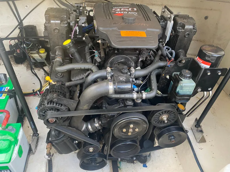 Slide: The Image of 2005 Chaparral Sunesta 254 engine compartment with visible components and wiring. - 15