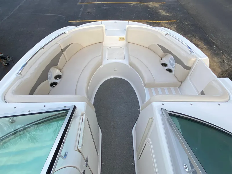 Slide: The Image of 2005 Chaparral Sunesta 254 boat interior with spacious seating and cup holders. - 18