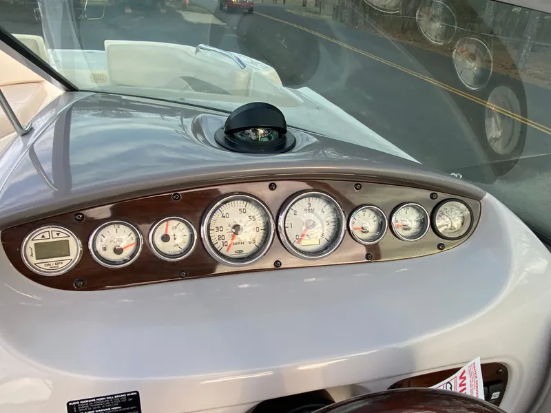 Slide: The Image of Dashboard of 2005 Chaparral Sunesta 254 boat with gauges and compass. - 19