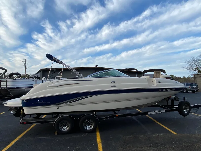 Slide: The Image of 2005 Chaparral Sunesta 254 boat on trailer under a partly cloudy sky. - 2