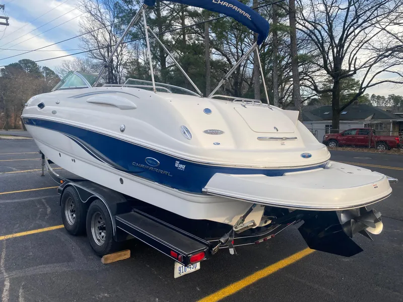 Slide: The Image of 2005 Chaparral Sunesta 254 boat on trailer in parking lot. - 33