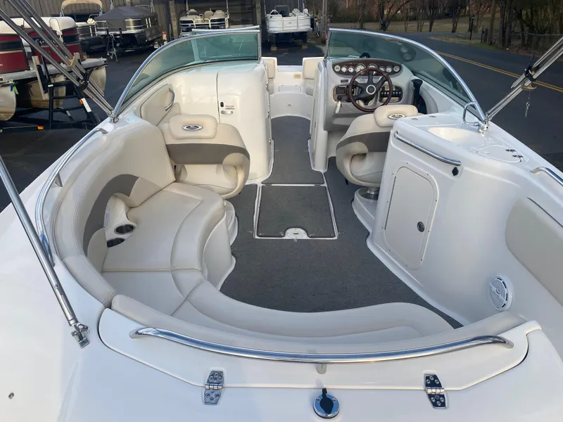 Slide: The Image of 2005 Chaparral Sunesta 254 boat interior with spacious seating and modern dashboard. - 37