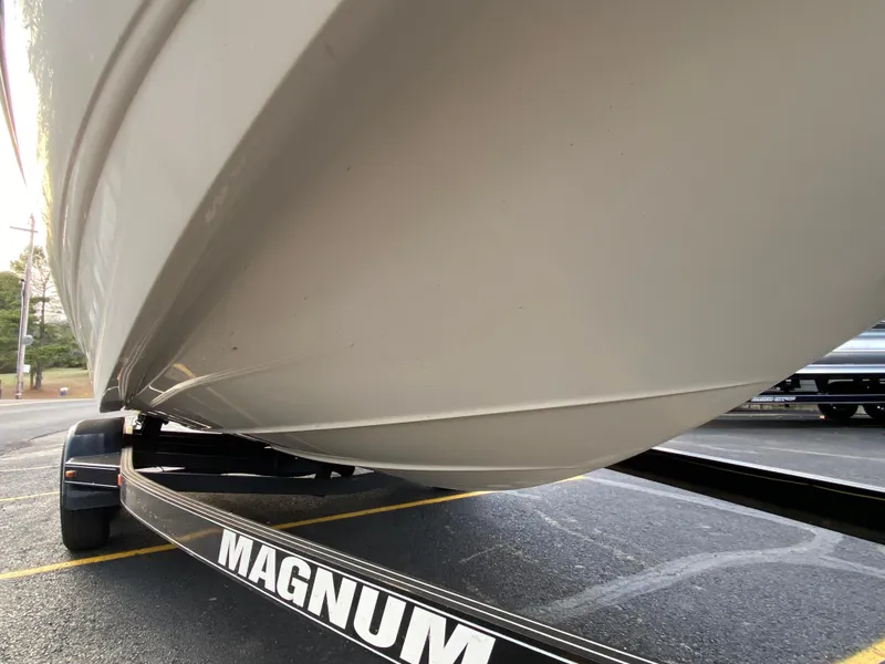 Slide: The Image of 2005 Chaparral Sunesta 254 boat on Magnum trailer, close-up view of hull. - 4