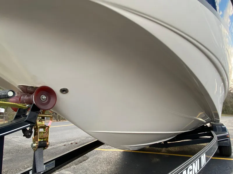 Slide: The Image of 2005 Chaparral Sunesta 254 boat on trailer, close-up of hull and roller. - 5