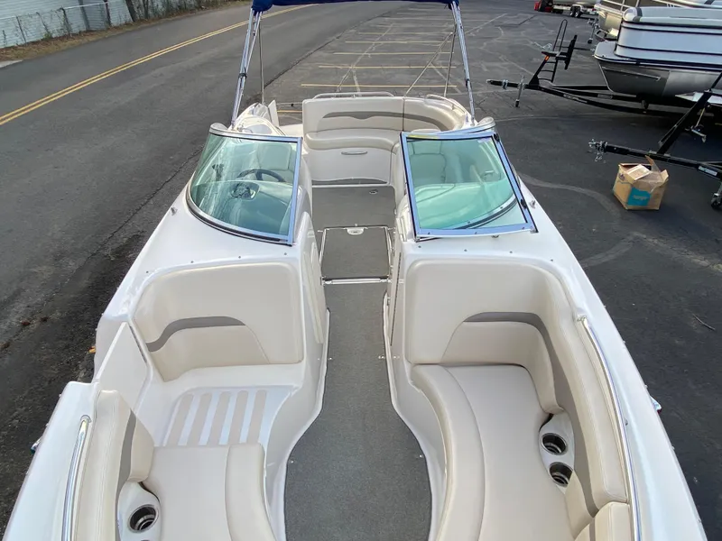 Slide: The Image of 2005 Chaparral Sunesta 254 boat with spacious seating and dual windshields. - 8