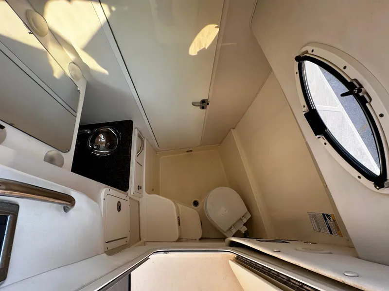 Slide: The Image of Interior of 2005 World Cat 320EC boat bathroom with sink and toilet. - 16