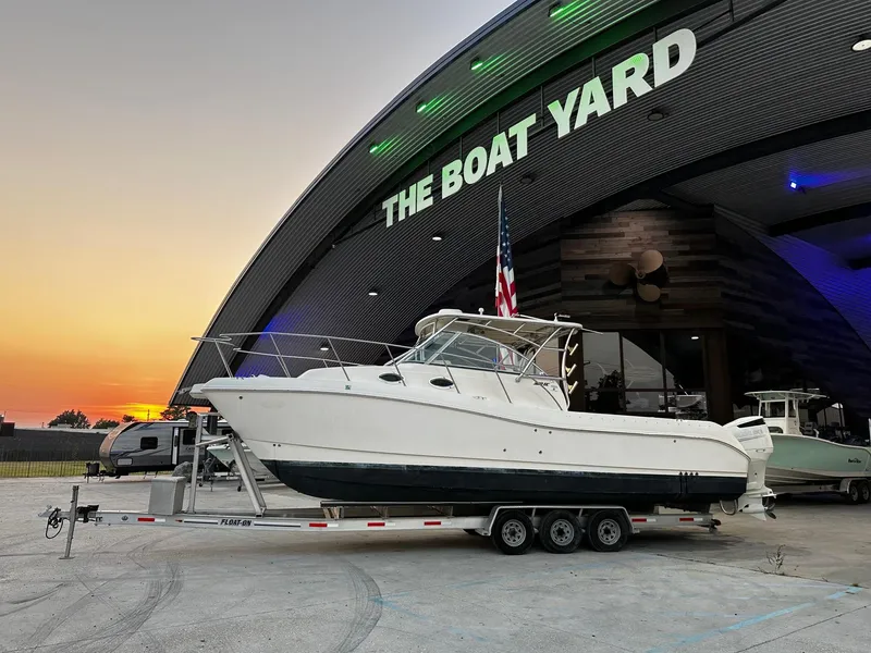 Slide: The Image of 2005 World Cat 320EC boat on trailer at The Boat Yard during sunset. - 20