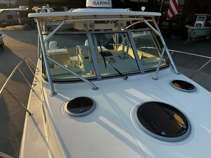 Slide: The Image of 2005 World Cat 320EC boat with Garmin equipment, docked in a marina. - 7