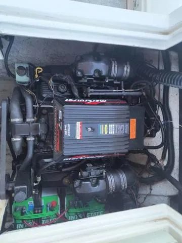 Slide: The Image of Engine compartment of a 1998 Ebbtide 2300 Mystique Deck Boat. - 21