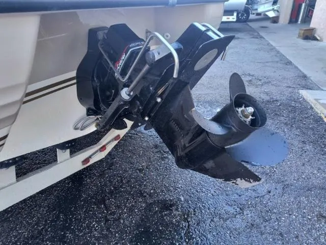 Slide: The Image of 1998 Ebbtide 2300 Mystique Deck Boat outboard motor on a trailer. - 22