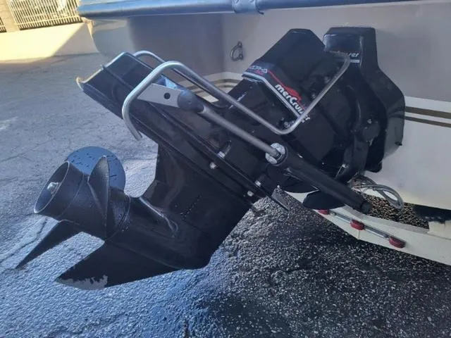 Slide: The Image of 1998 Ebbtide 2300 Mystique Deck Boat with MerCruiser outdrive, close-up view. - 23