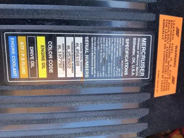 Slide: The Image of Label on 1998 Ebbtide 2300 Mystique Deck Boat showing MerCruiser specifications and serial numbers. - 25