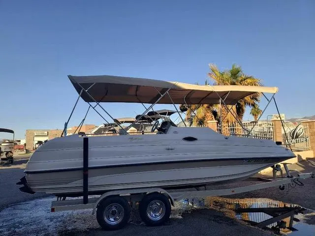 Slide: The Image of 1998 Ebbtide 2300 Mystique Deck Boat on trailer with canopy, parked outdoors. - 5