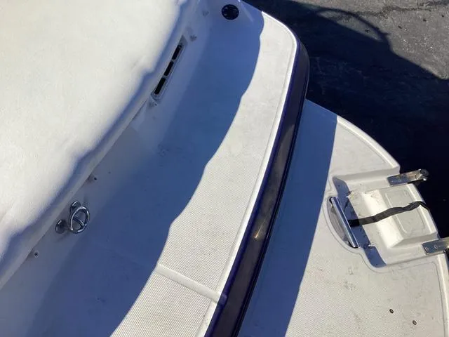 Slide: The Image of 2012 Monterey Sport Boat 184FS, white deck with ladder, partial view. - 10