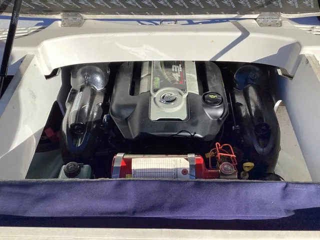 Slide: The Image of Engine compartment of 2012 Monterey Sport Boat 184FS, featuring a powerful engine setup. - 12