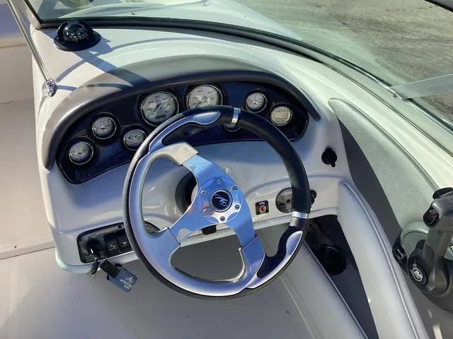 Slide: The Image of Steering wheel and dashboard of 2012 Monterey Sport Boat 184FS. - 14