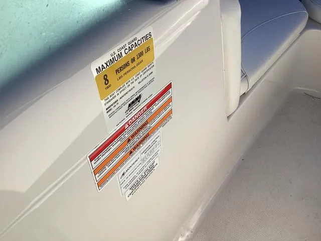 Slide: The Image of 2012 Monterey Sport Boat 184FS capacity label, seating for eight, safety warnings visible. - 15