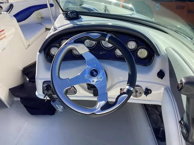 Slide: The Image of 2012 Monterey Sport Boat 184FS dashboard with steering wheel and gauges. - 7