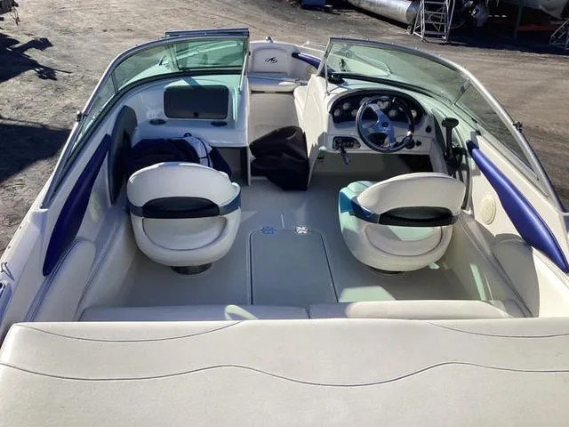 Slide: The Image of 2012 Monterey Sport Boat 184FS interior with seating and steering wheel. - 9