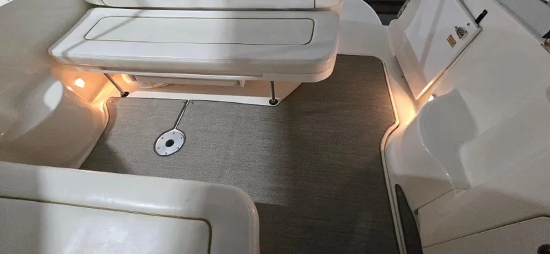 Slide: The Image of 2002 Sea Ray 300 Sundancer interior with seating and ambient lighting. - 22