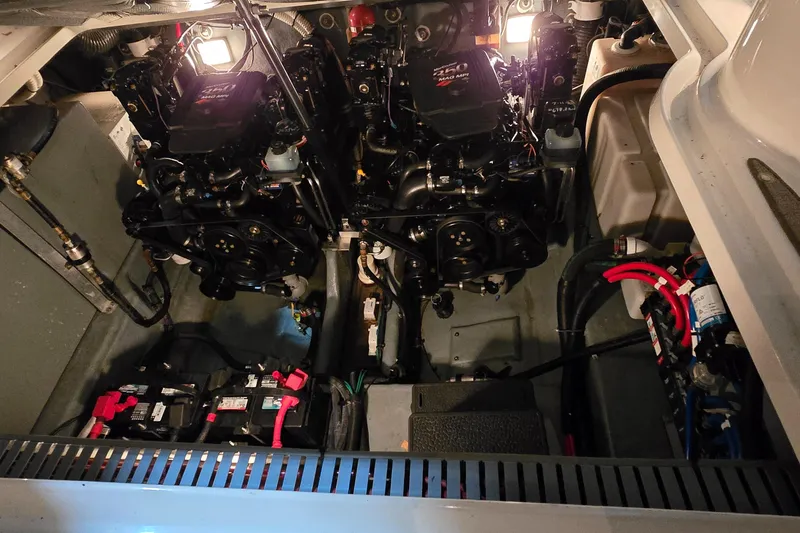 Slide: The Image of Engine compartment of a 2002 Sea Ray 300 Sundancer with dual engines and batteries. - 43