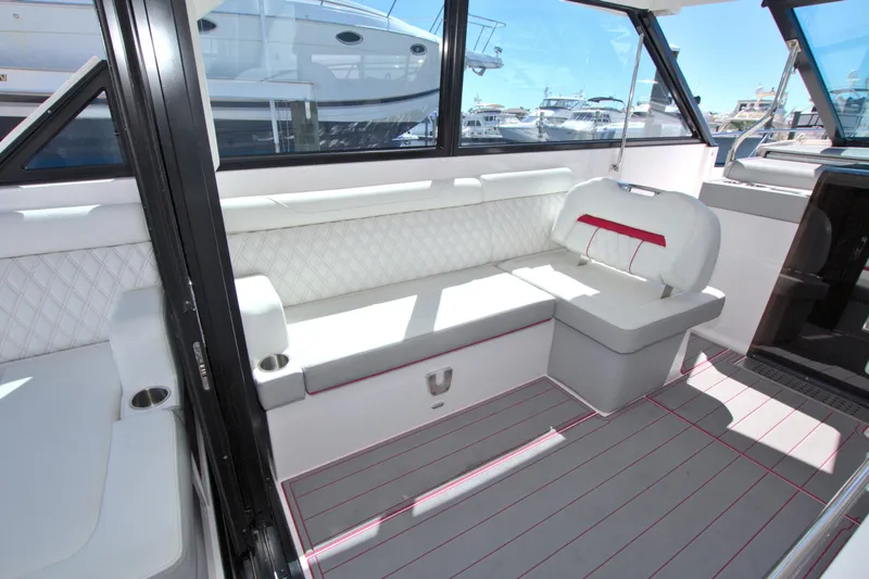 Slide: The Image of 2021 Regal 36 XO boat interior with white seating and modern design. - 24