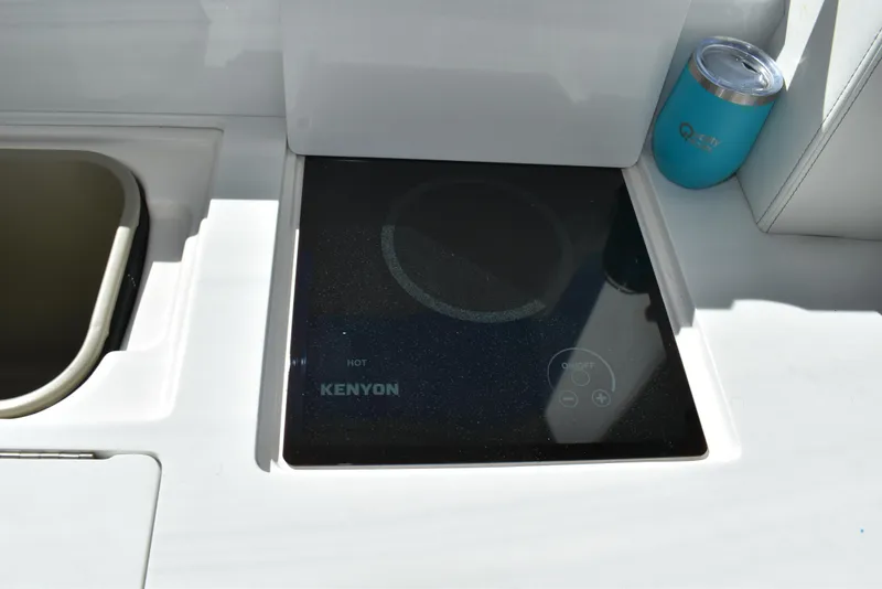 Slide: The Image of Built-in Kenyon cooktop on 2021 Regal 36 XO yacht kitchen counter. - 27