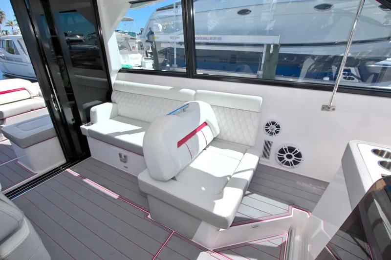 Slide: The Image of 2021 Regal 36 XO yacht interior with white seating and modern design. - 36