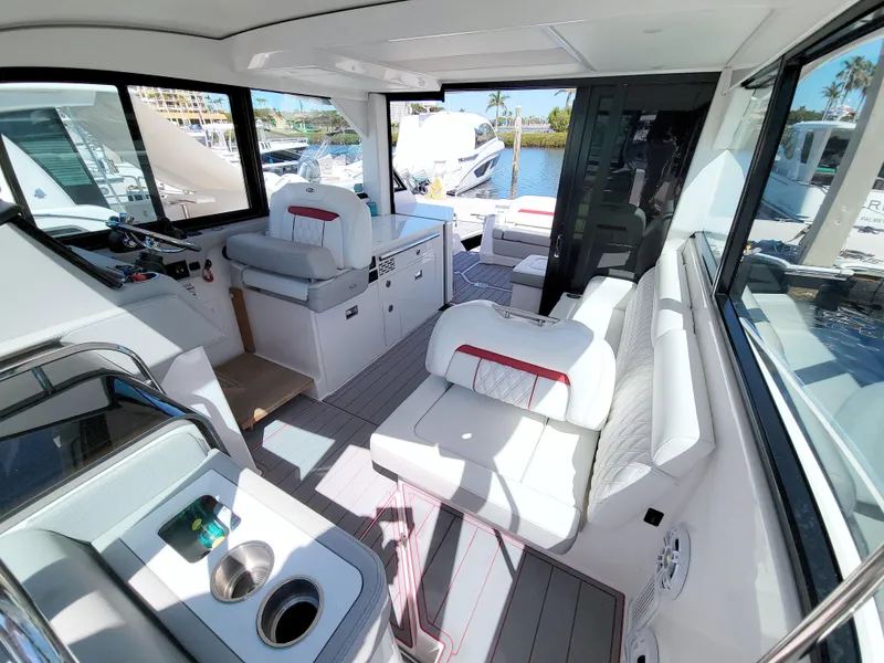 Slide: The Image of 2021 Regal 36 XO yacht interior with white seating and modern design. - 49