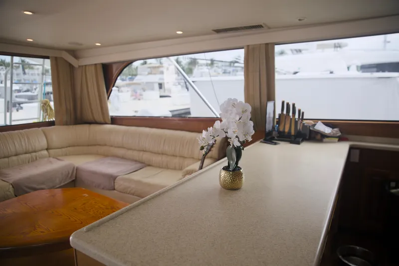 Slide: The Image of Luxurious interior of a 1999 Viking 58 yacht with elegant seating and decor. - 20