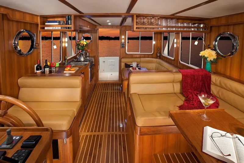 Slide: The Image of Luxurious interior of 2025 Helmsman Trawlers 38 Sedan with elegant wood finish. - 18
