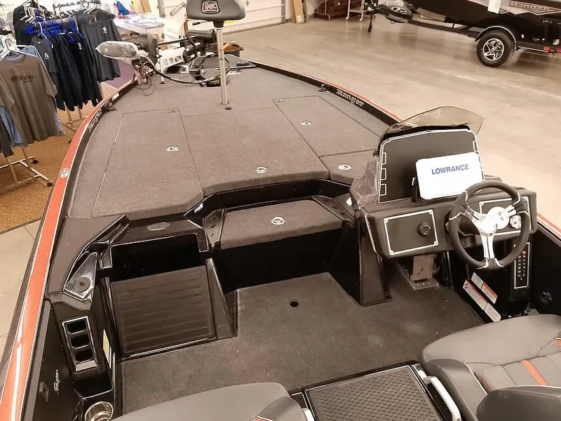 Slide: The Image of 2025 Ranger Z520 SC boat interior with steering wheel and Lowrance electronics. - 13