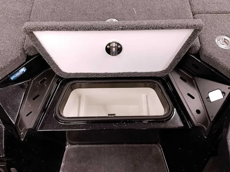 Slide: The Image of 2025 Ranger Z520 SC boat storage compartment with open lid, showcasing interior space. - 14