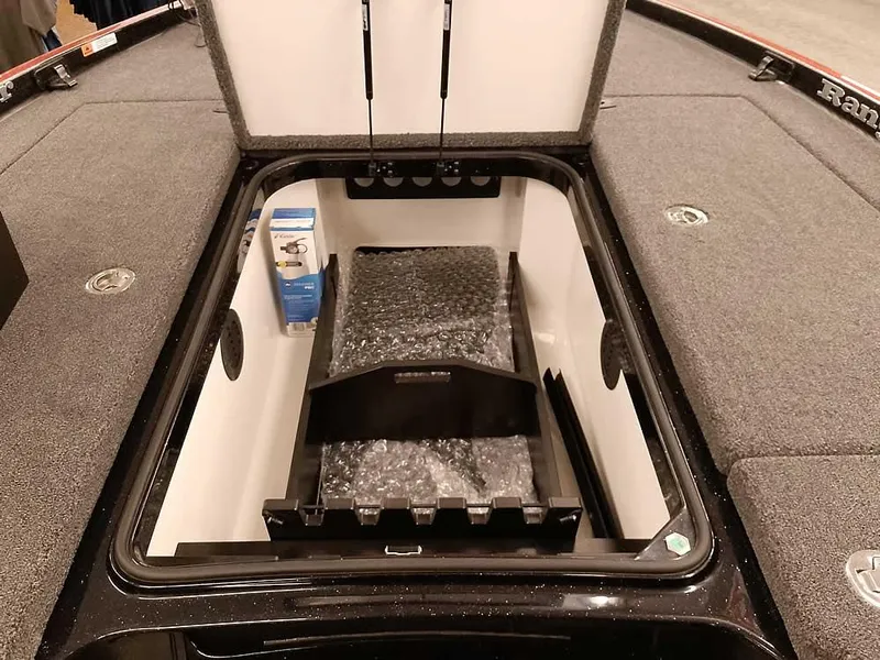 Slide: The Image of 2025 Ranger Z520 SC boat storage compartment with organized interior and accessories. - 15