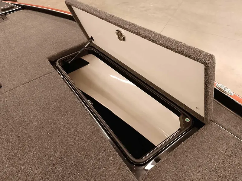 Slide: The Image of 2025 Ranger Z520 SC boat storage compartment with open lid, showcasing interior space. - 18