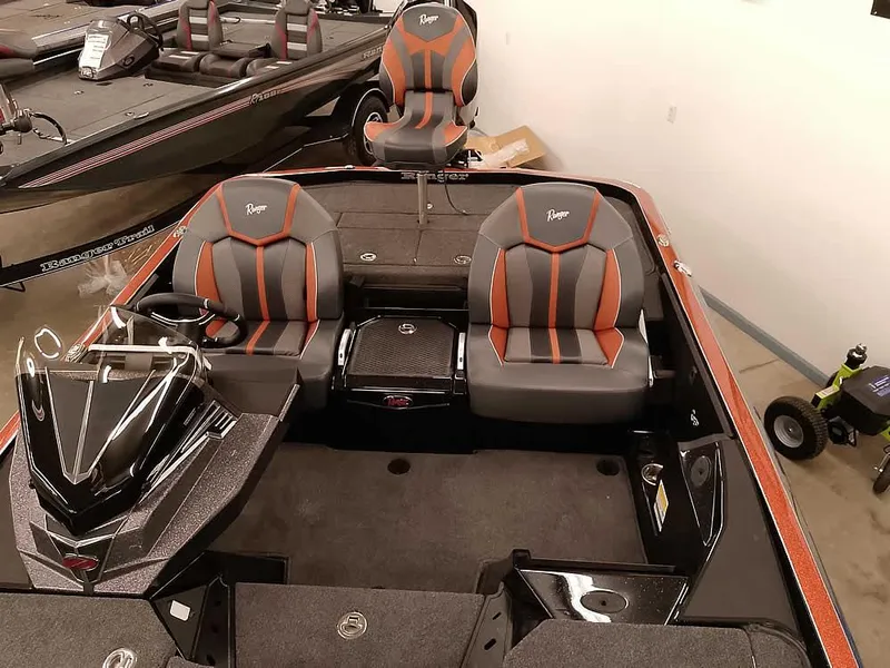 Slide: The Image of 2025 Ranger Z520 SC boat interior with stylish seating and modern design. - 23