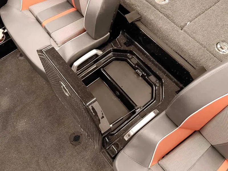 Slide: The Image of 2025 Ranger Z520 SC boat storage compartment with open lid, showcasing interior design and seating. - 24