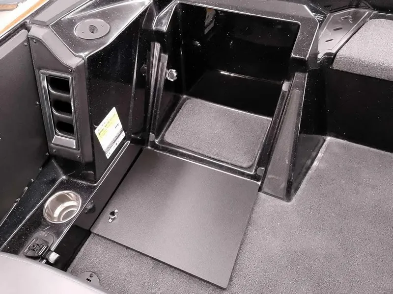 Slide: The Image of 2025 Ranger Z520 SC boat interior with storage compartment and cup holder. - 26