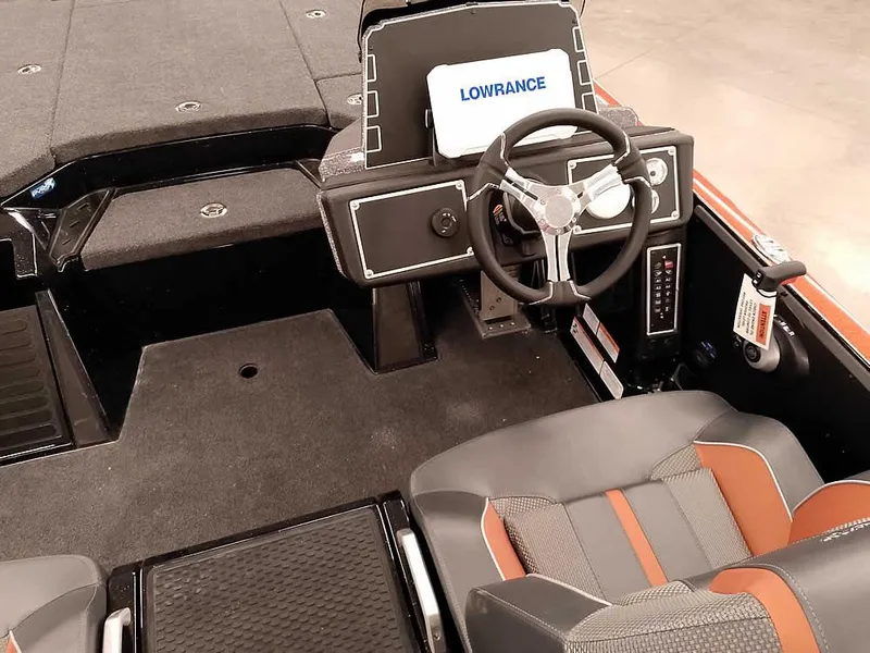 Slide: The Image of 2025 Ranger Z520 SC boat interior with steering wheel and Lowrance display. - 28