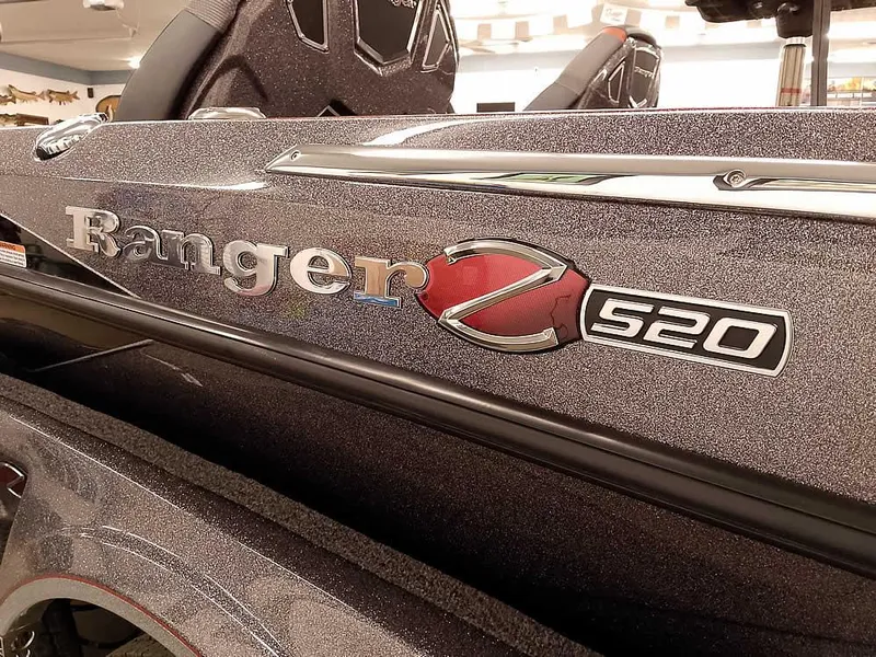 Slide: The Image of 2025 Ranger Z520 SC boat, close-up of logo and seating area. - 3