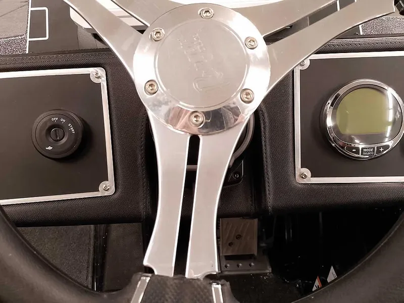 Slide: The Image of Steering wheel and dashboard of 2025 Ranger Z520 SC boat. - 30
