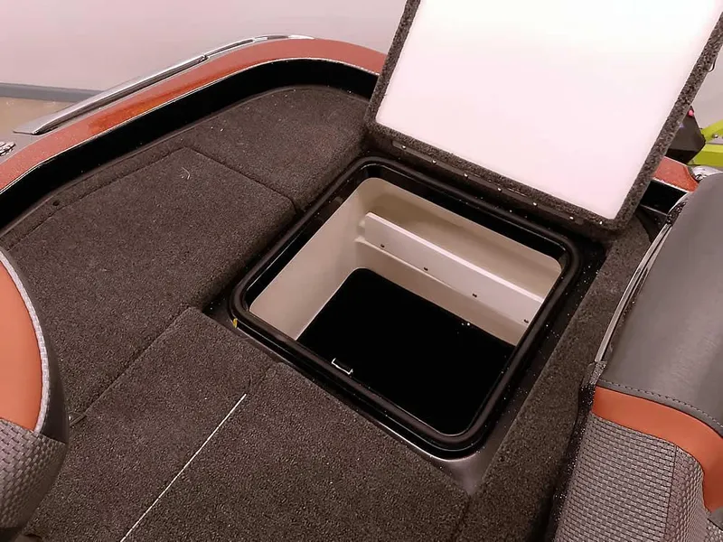 Slide: The Image of 2025 Ranger Z520 SC boat storage compartment with open lid, showcasing interior space. - 34