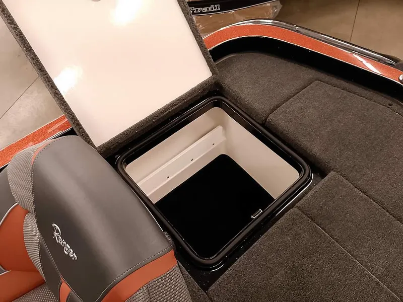 Slide: The Image of 2025 Ranger Z520 SC boat storage compartment with open lid, showcasing interior space. - 35
